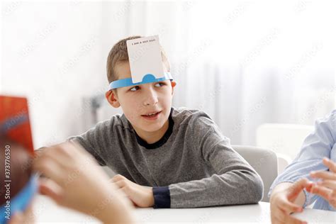 game with cards on forehead